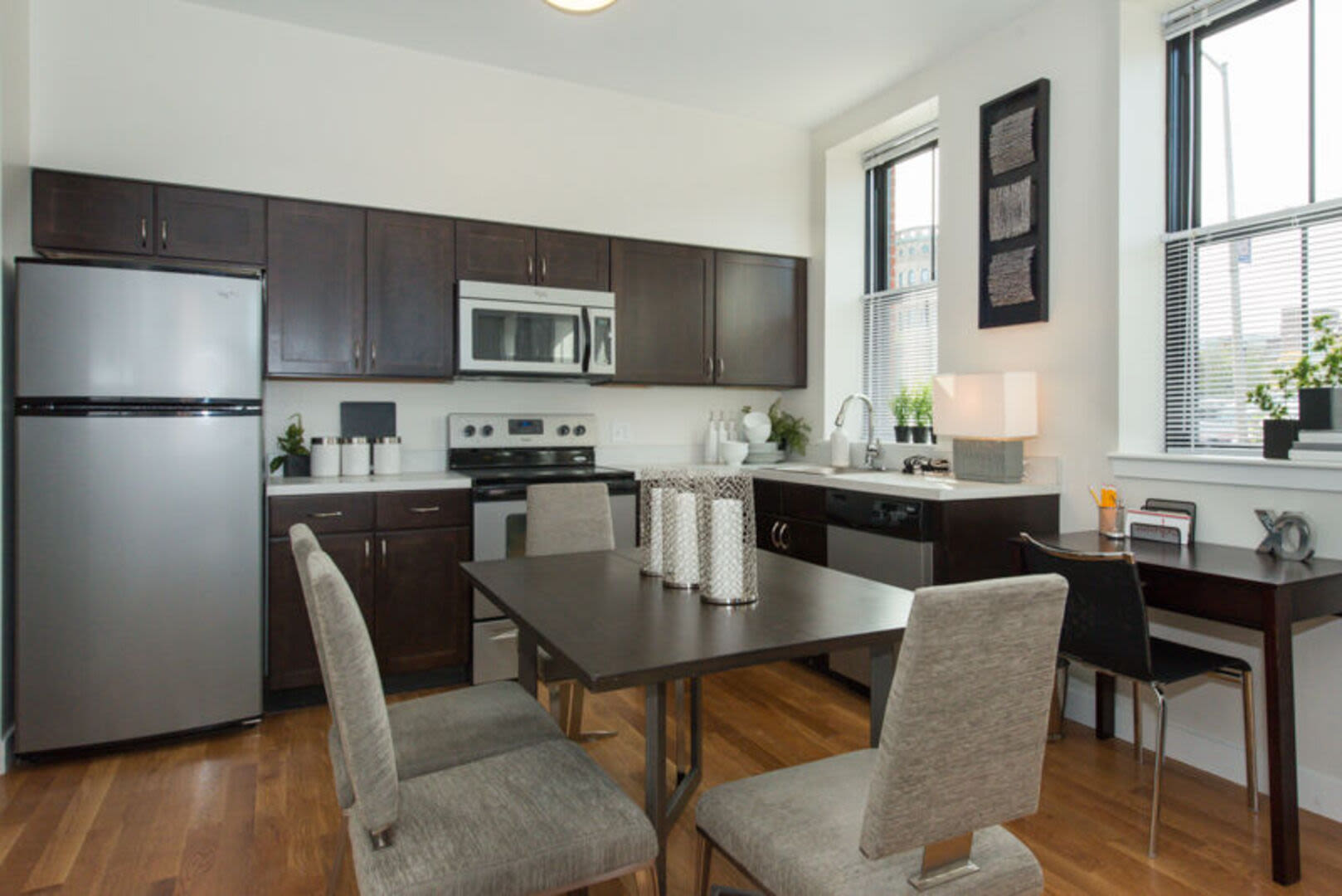 Kitchen with connecting dining table at Station Lofts in Brockton, Massachusetts