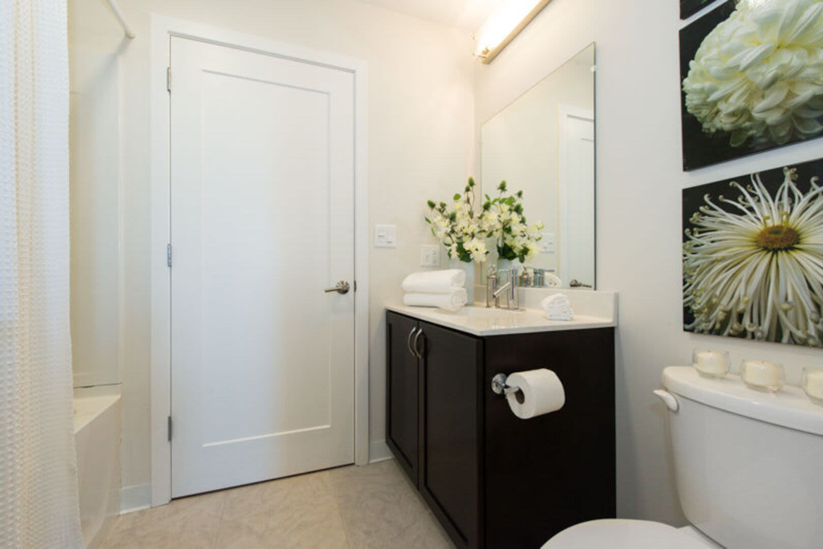Bathroom with bathtub and cabinets at Station Lofts in Brockton, Massachusetts