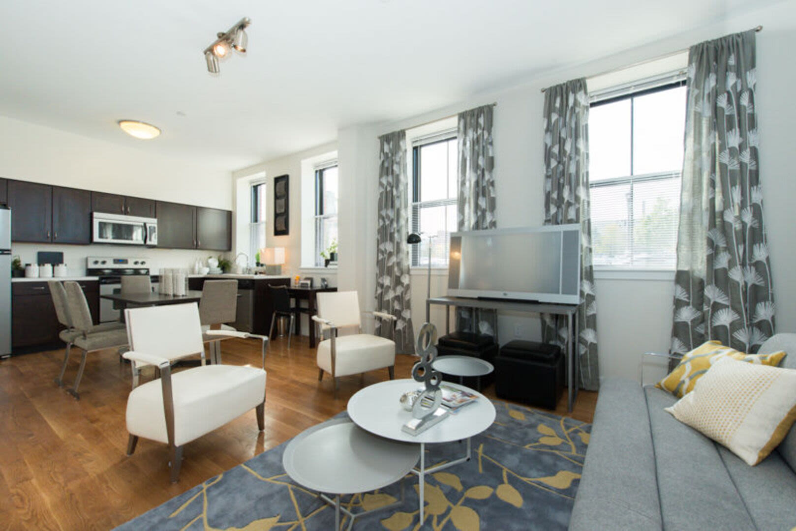 Living space with a view of the dining room Station Lofts in Brockton, Massachusetts
