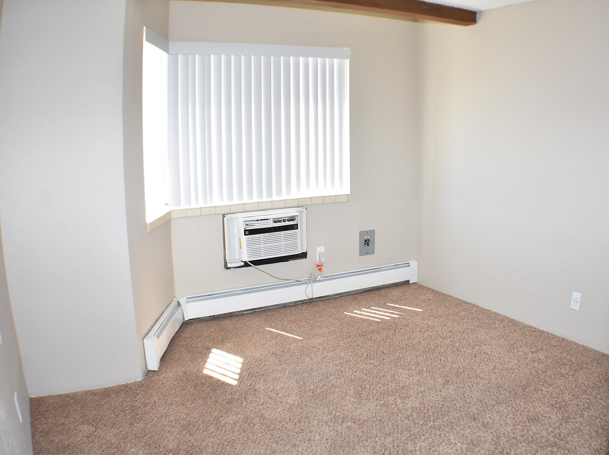 Bedroom with large window at Truckee River Terrace in Reno, Nevada