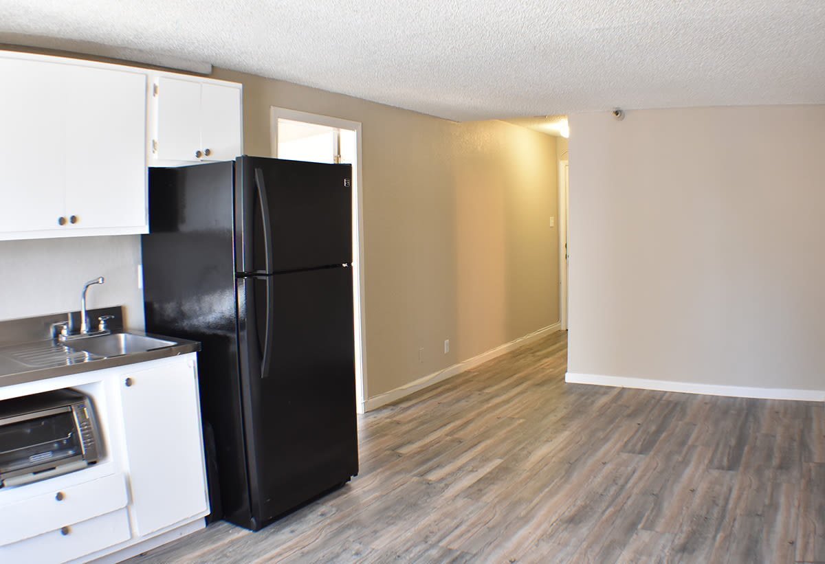 Kitchen with appliances and wooden flooring at Truckee River Terrace in Reno, Nevada