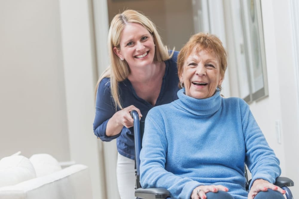 Staff assists resident in apartment at Sunset Park Place in Dubuque, Iowa.