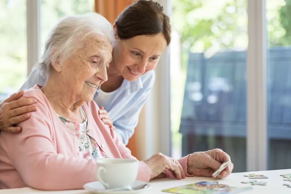 Residents working on a puzzle at Sunset Park Place in Dubuque, Iowa.