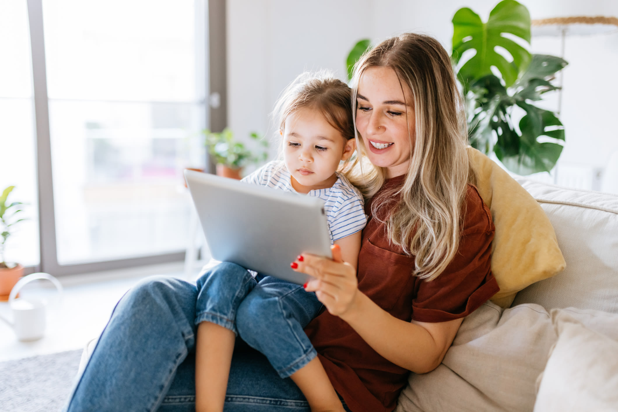 Mother with her kids on ipad at The Commons in Bensalem, Pennsylvania