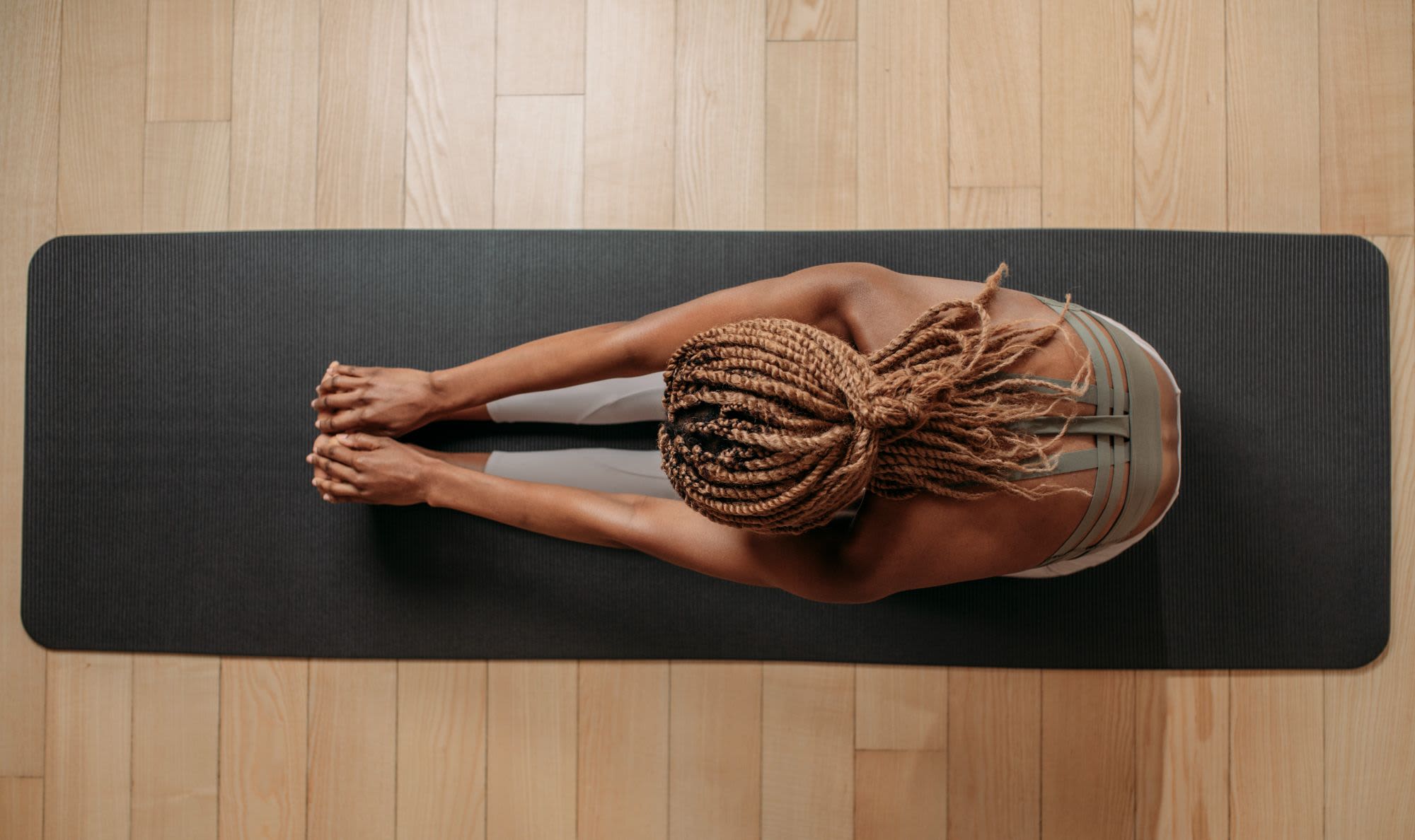 Resident doing yoga at The Pique in Folsom, California