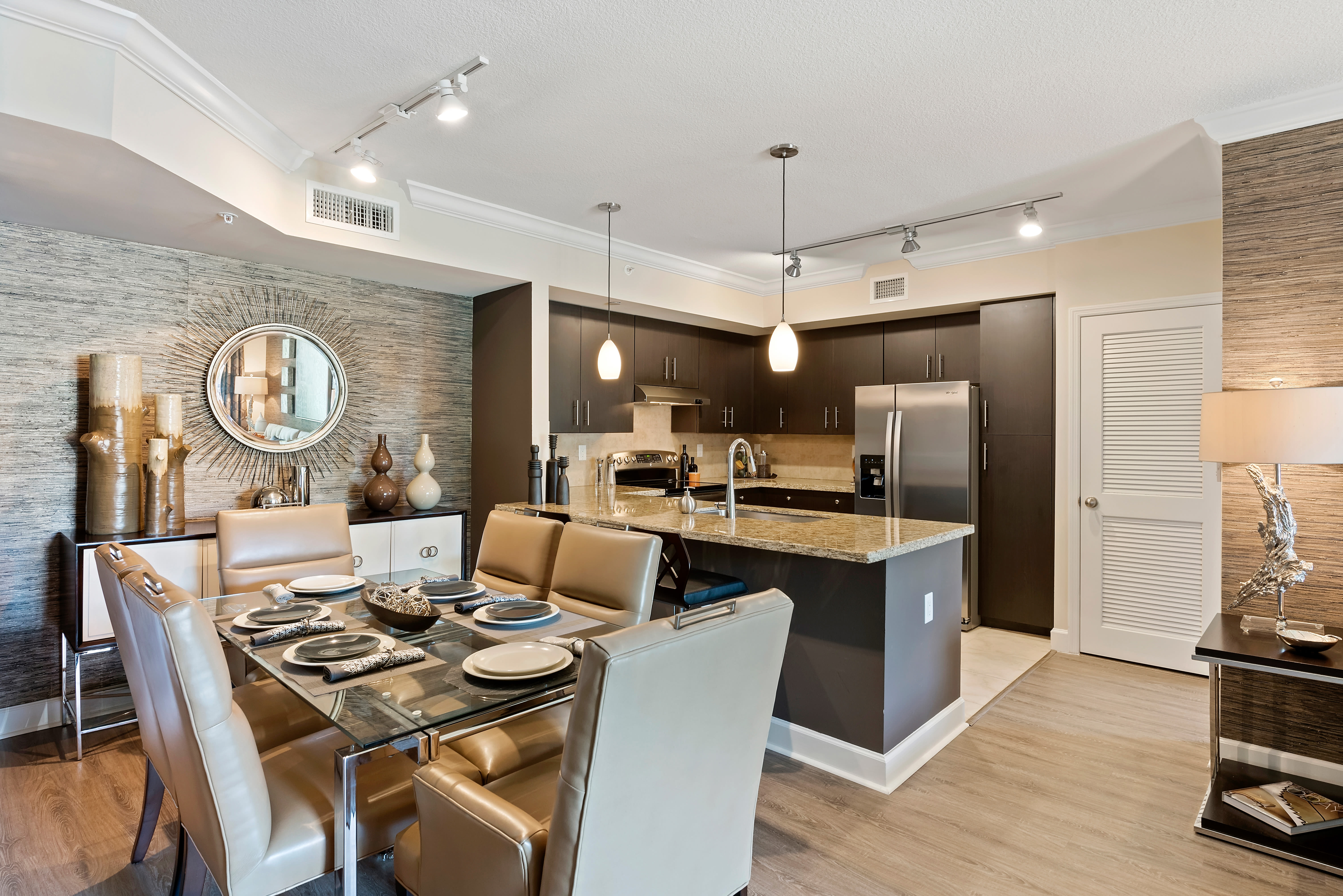 Beautifully decorated model dining room and kitchen at The Residences at Lakehouse in Miami Lakes, Florida