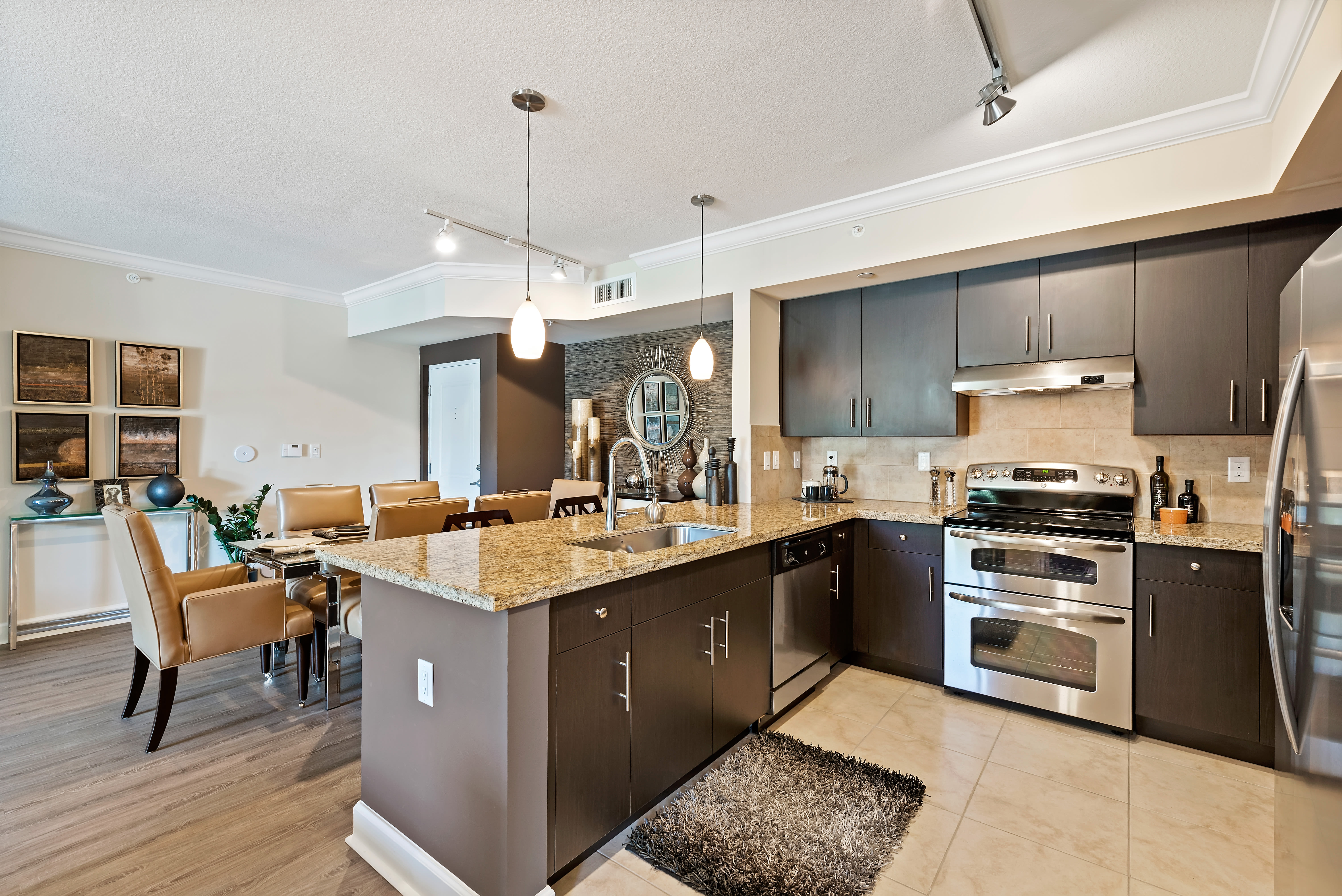 Fully-equipped gourmet kitchen with expansive counter space at The Residences at Lakehouse in Miami Lakes, Florida