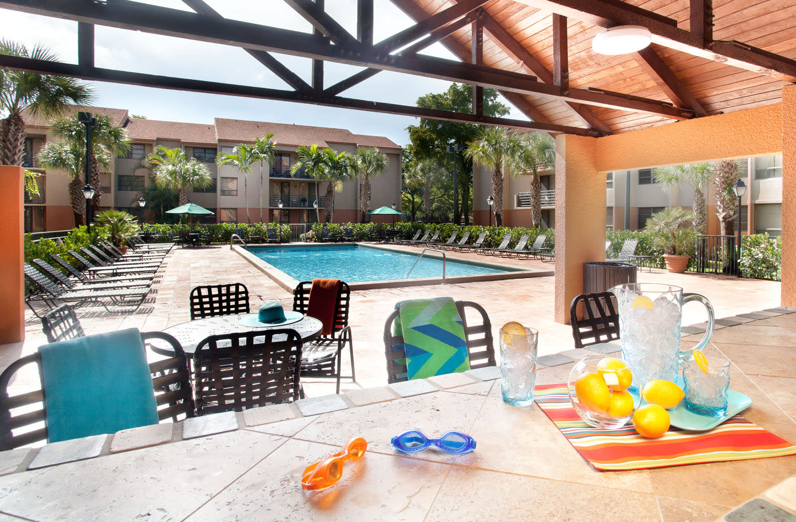 View of the swimming pool from the poolside gazebo at New Barn Apartments in Miami Lakes, Florida