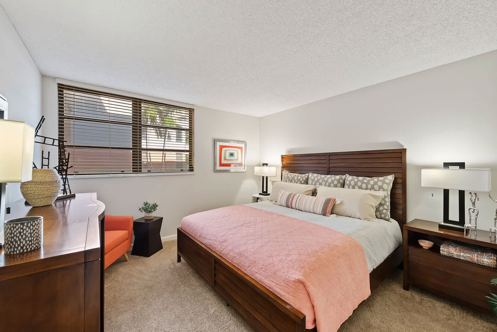 Beautiful bedroom with king size bed at New Barn Apartments in Miami Lakes, Florida