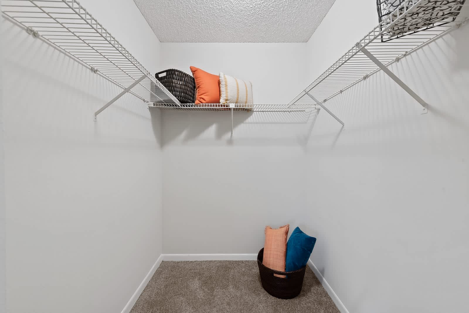 Spacious walk-in closet at New Barn Apartments in Miami Lakes, Florida