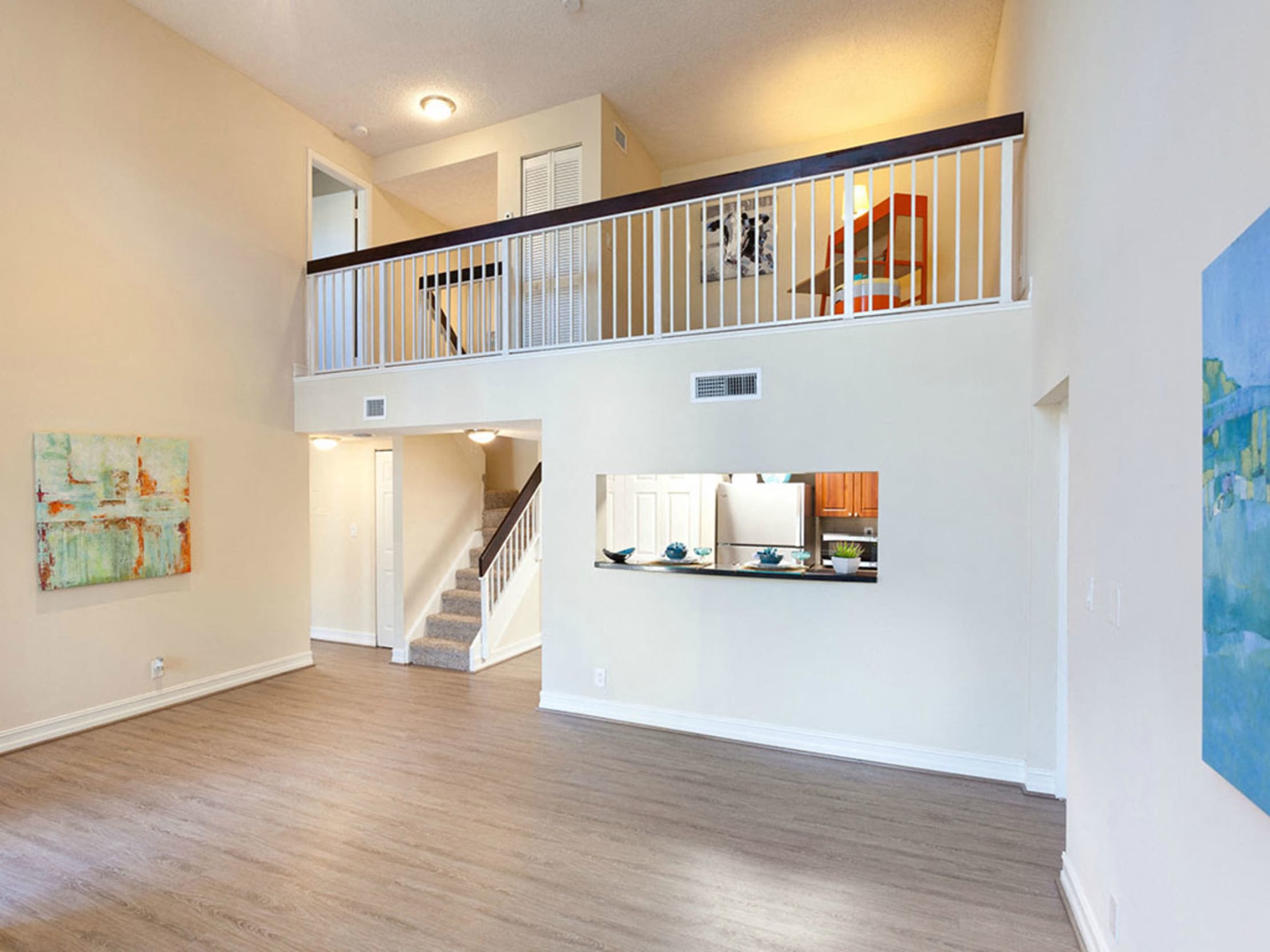 Townhome featuring hardwood floors and open concept floorplan at Fountain House Apartments in Miami Lakes, Florida