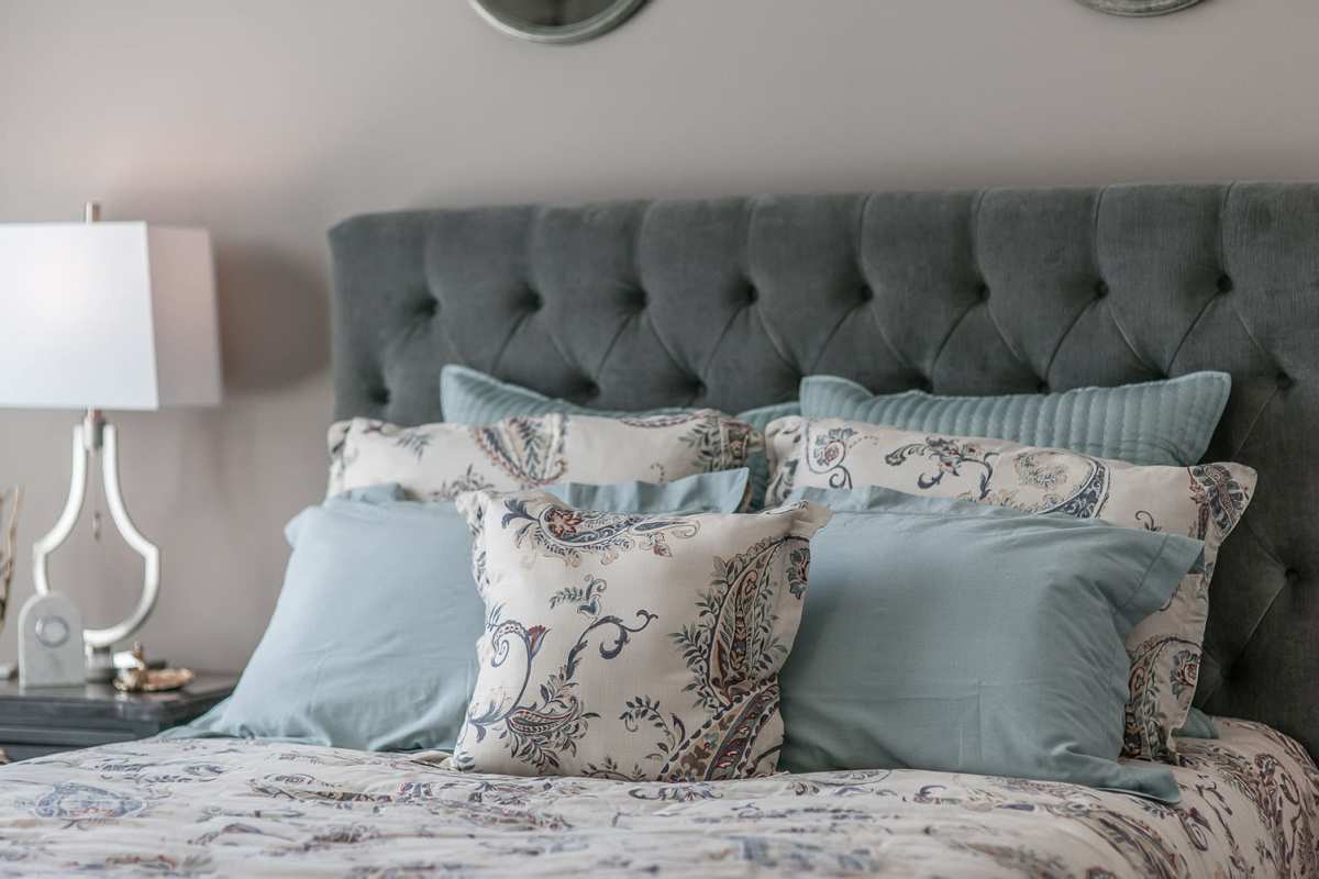 Comfy bed in a model bedroom at Vintage at the Avenue, Murfreesboro, Tennessee