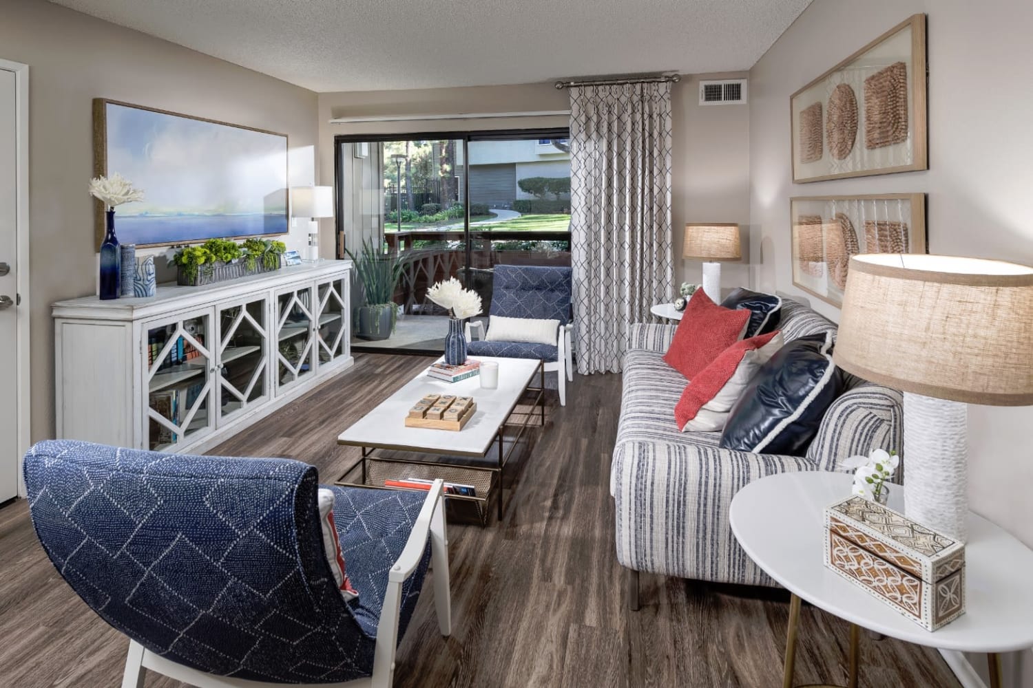 Well appointed living room at Parcwood Apartments in Corona, California