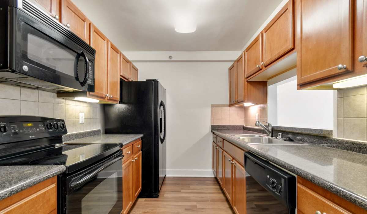 Kitchen with wooden cabinets and appliances at Bethesda Hill in Bethesda, Maryland 