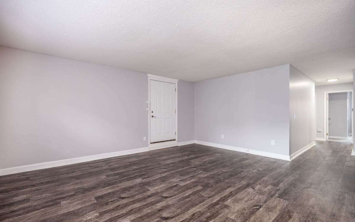 Spacious living room at Oakwood Manor Apartments in Fairport, New York