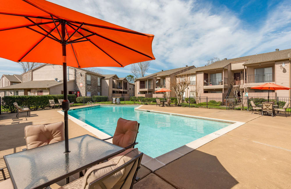 Covered table by the pool at Summit at 7700 in Houston, Texas