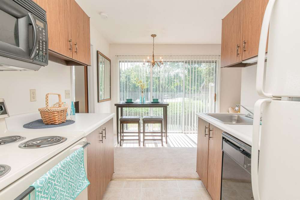 Modern kitchen with white appliances at Waterford Manors in Manchester, Missouri