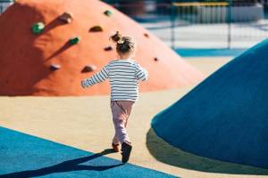 Resident child playing near The Gardens At Duncan Apartments in Duncan, Oklahoma