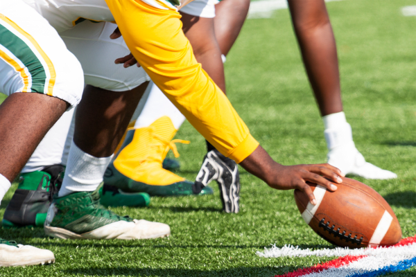 The start of a big play during an exciting football game near BB Living Light Farms in Celina, Texas