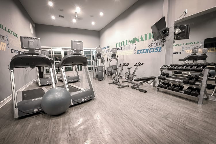 Modern fitness center with individual work out stations at Sage Corpus Christi in Corpus Christi, Texas