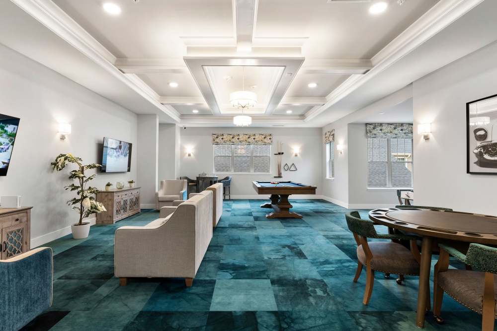 Common seating area with game at The Barclay at Whiskey Road in Aiken, South Carolina