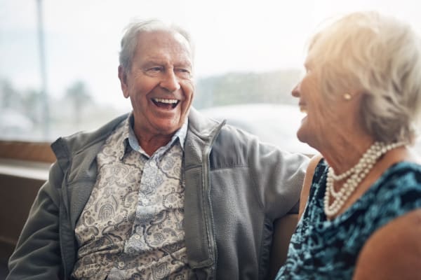 A senior couple talking at Regency Park Senior Living, Inc.