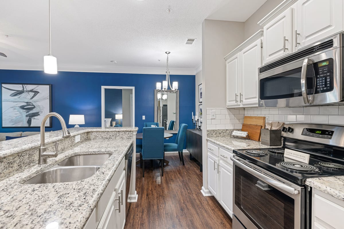 Kitchen with wood style floors at The Preserve at Ballantyne Commons in Charlotte, North Carolina