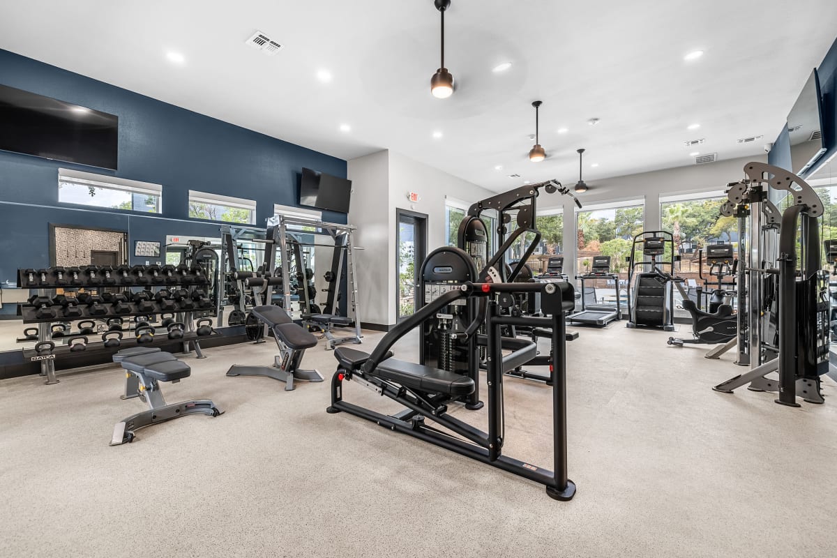 Cardio and weight machines in the fitness center at Marquis at Crown Ridge in San Antonio, Texas