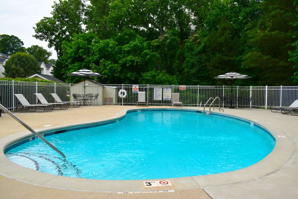 Swimming pool with lounge beds at Riverfront in Mount Holly, North Carolina