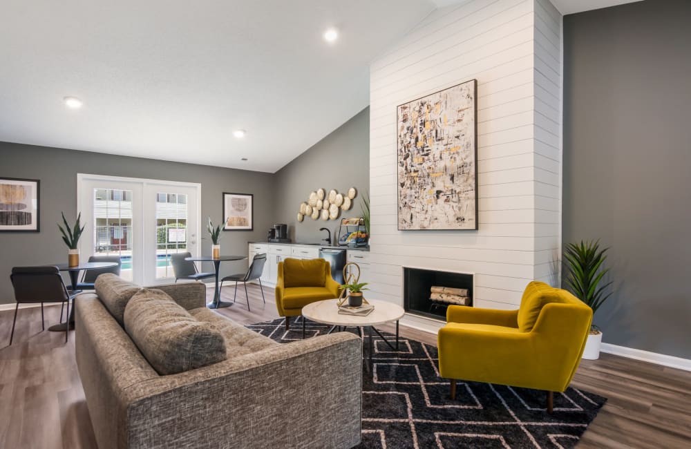 Living room with plank flooring in a model home at Sharon Pointe Apartment Homes in Charlotte, North Carolina