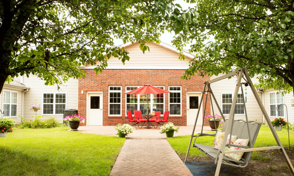 Outdoor walkway leading to independent living residences at Randall Residence of Decatur in Decatur, Illinois