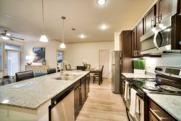 Ultra-modern kitchen in a model apartment at Milwee Street Apartments in Houston, Texas