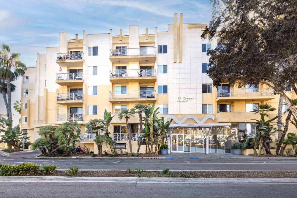 Luxury palm trees and balconies in view at Capri Apartments in Marina Del Rey, California