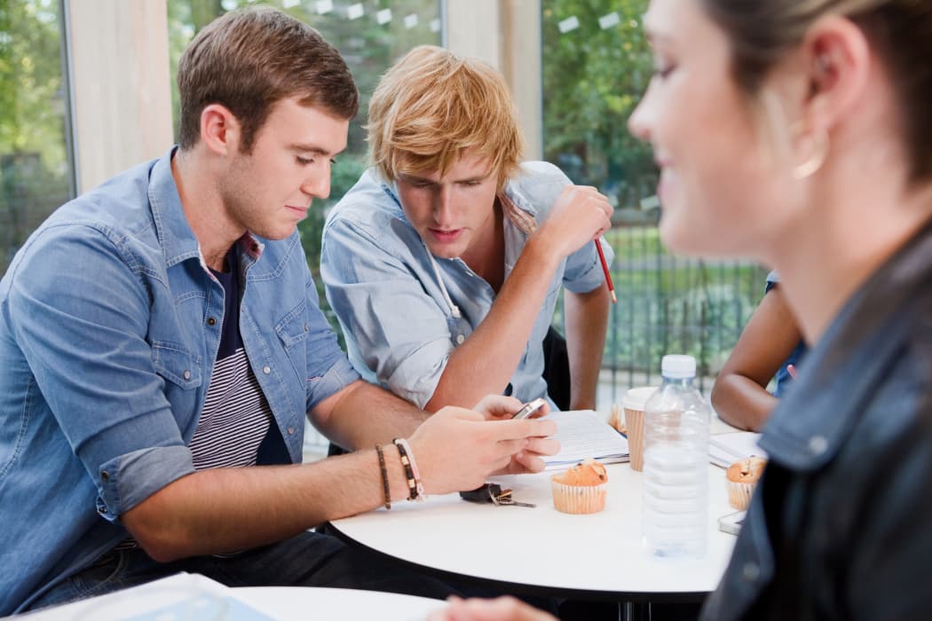 Friends studying at Cherry Stone Apartments in Norman
