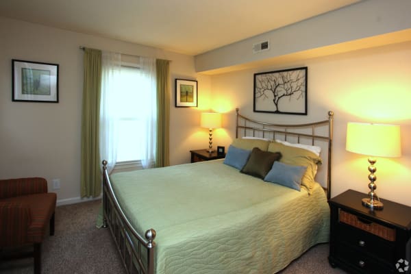 Naturally well-lit bedroom at apartments in Greensboro, North Carolina
