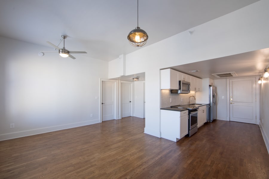 Spacious apartment interior with hardwood flooring at Maverick Apartments in San Antonio, Texas