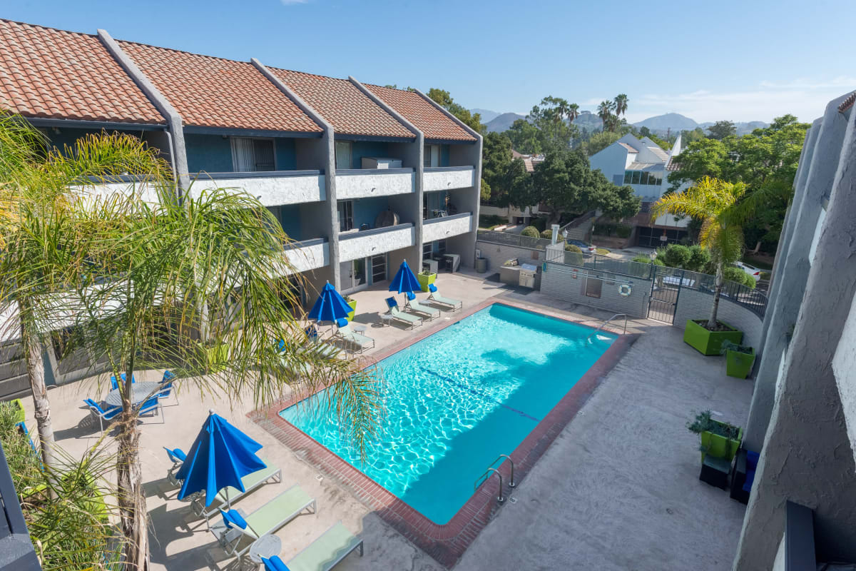 Pool with patio and lounge chairs at The Howard, Glendale, California