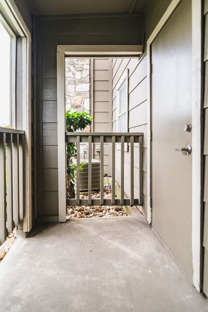 Private patio with railing at Villa De Oro in San Antonio, Texas