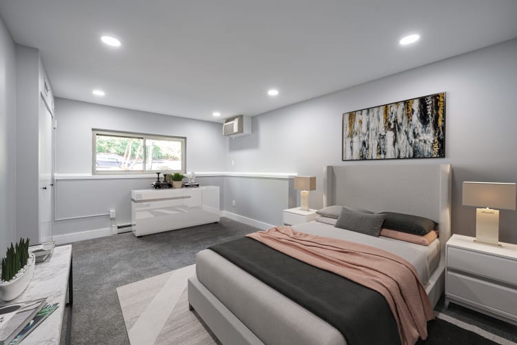 Spacious, well-lit apartment bedroom at Whitewood Pond Apartments in North Haven, Connecticut