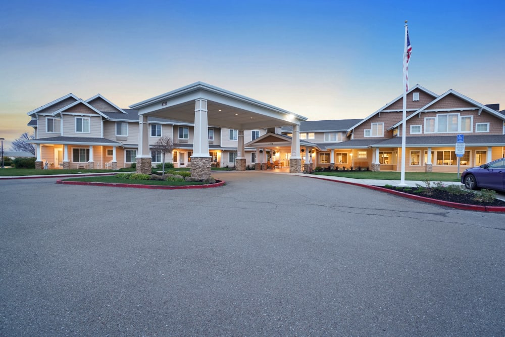 Building entrance with American flag flowing outside at The Commons at Dallas Ranch in Antioch, California