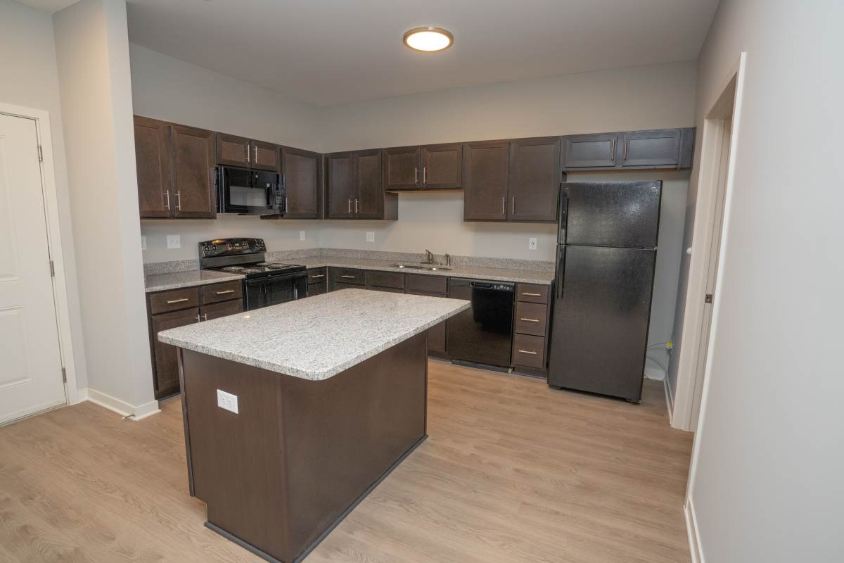 Kitchen with a dishwasher and refrigerator at Donerail Run in Louisville, Kentucky