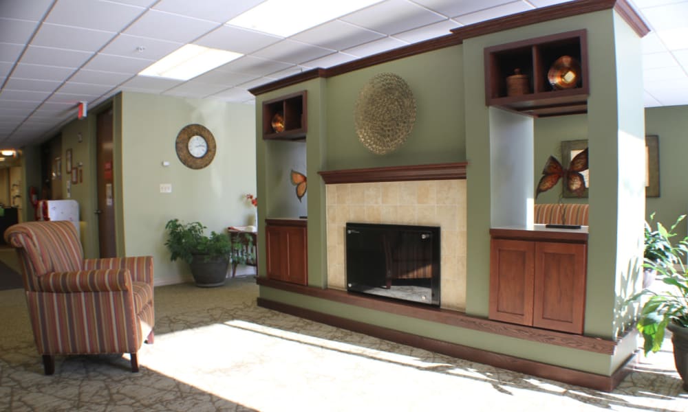 Common area with fireplace and natural light at Edgerton Care Center in Edgerton, Wisconsin