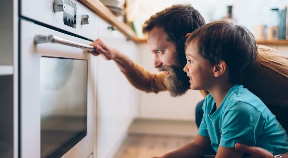 Father and son prepare a mid-day snack in their kitchen at Kennedy Highlands, Mc Kees Rocks, Pennsylvania