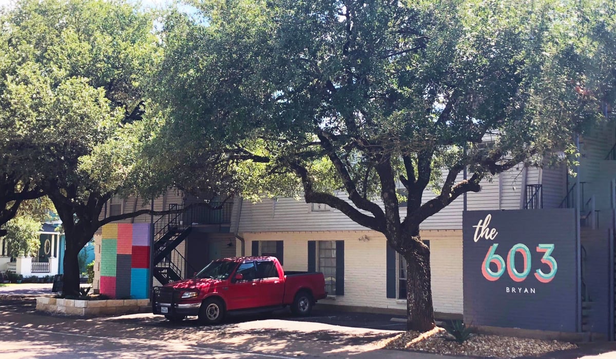 Community sign and parking at The 603 in Bryan, Texas