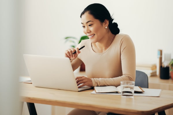 Caretaker on a laptop from Living Care Lifestyles in Seattle, Washington