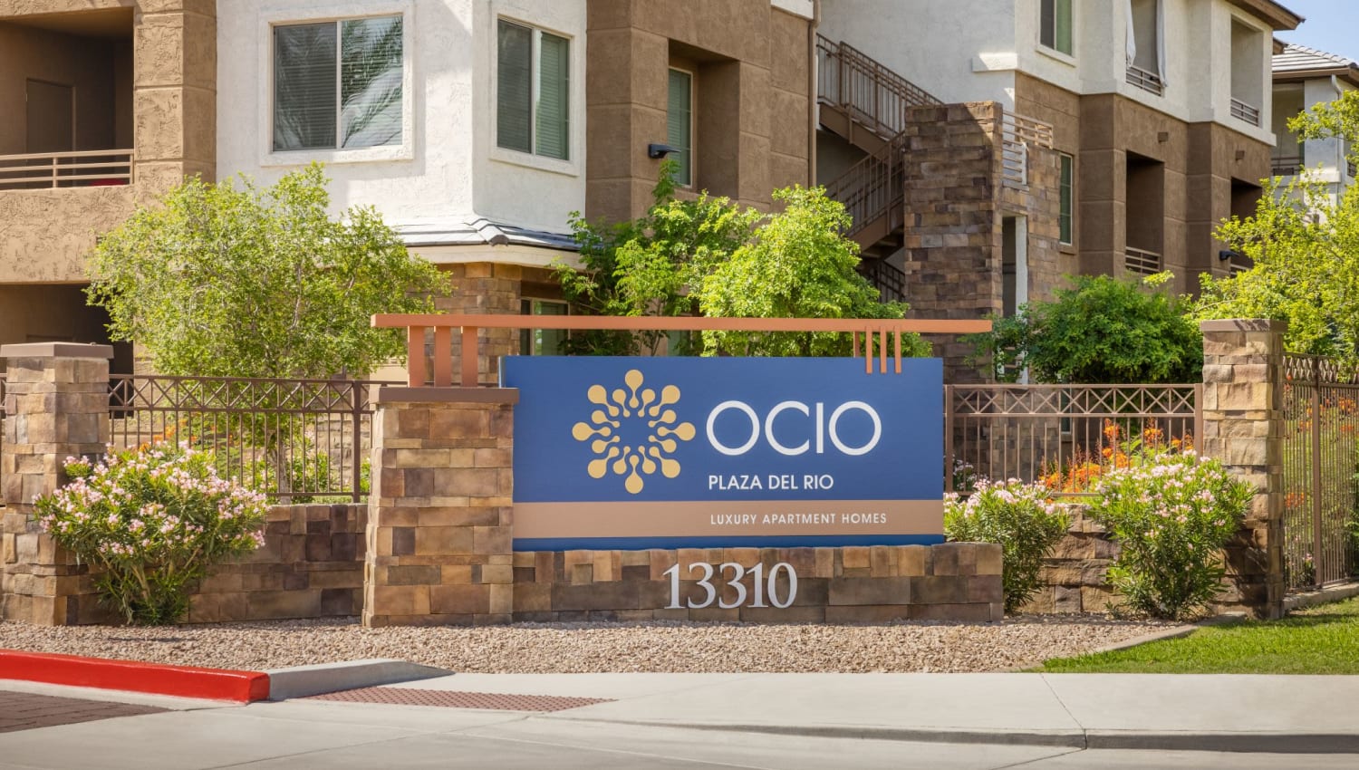 Entrance sign at Ocio Plaza Del Rio in Peoria, Arizona