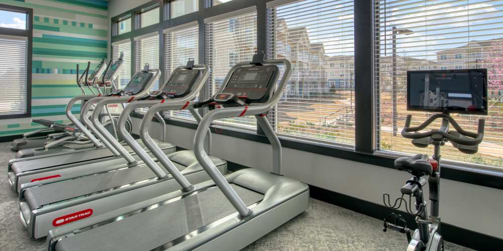 Fitness center with treadmills and windows at The Mason in Augusta, Georgia