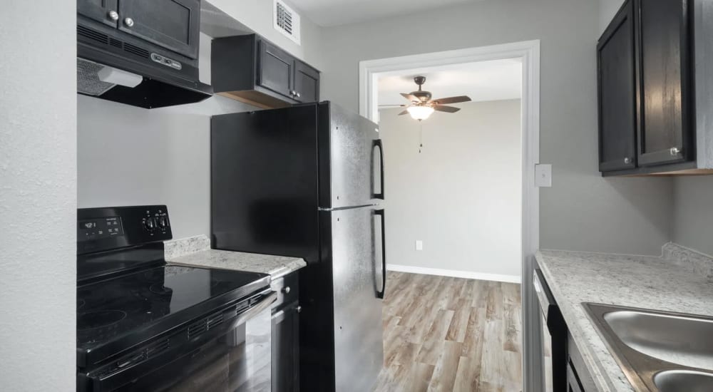 Kitchen with appliances at The Mirabel in Fort Worth, Texas