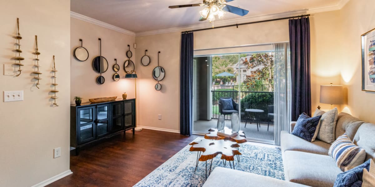Spacious and modern style living room with entertainment center nook at Marquis of Carmel Valley in Charlotte, North Carolina