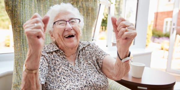 Resident sitting and laughing at East Troy Manor in East Troy, Wisconsin